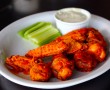 Buffalo Wings - 10 chicken wings in buffalo sauce, celery & blue cheese dressing